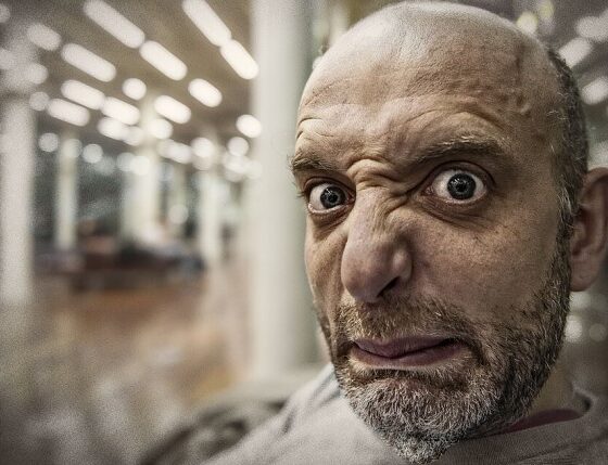 Disgusted man looking at the camera